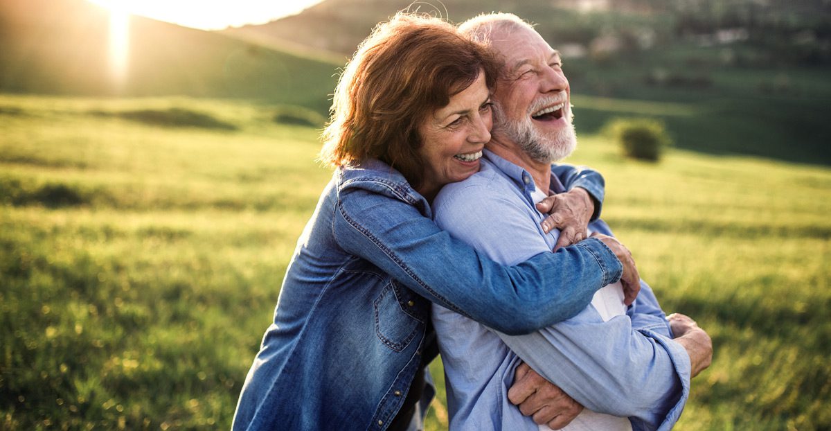 Couple-hugging-outside-in-nature