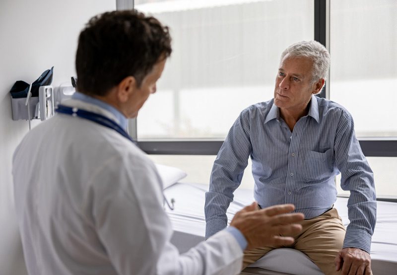 Doctor-talking-to-patient-in-office