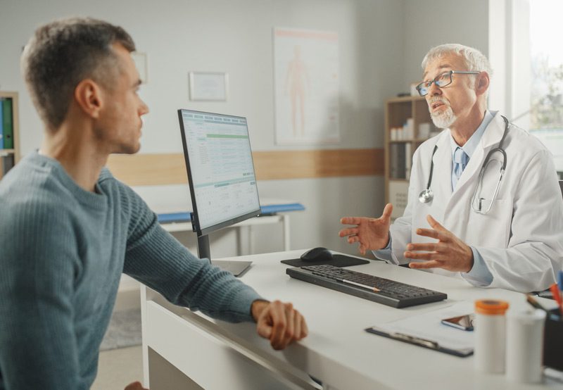 Doctor-talking-with-young-male-patient