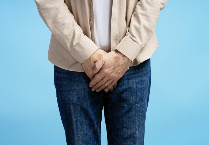 Senior-man-experiencing-discomfort-and-holding-groin-area